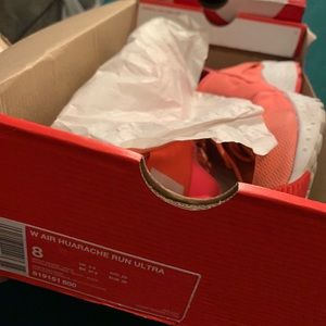 Neon orange Nike huaraches